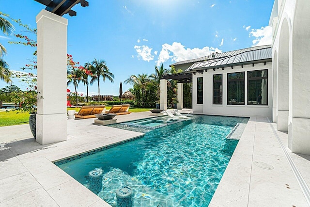 outdoor pool with a patio, an in ground hot tub, and a pergola