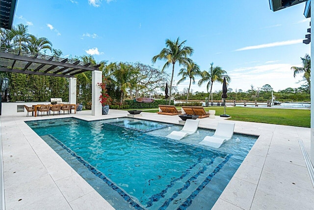 view of pool with a patio area, a lawn, and a pergola