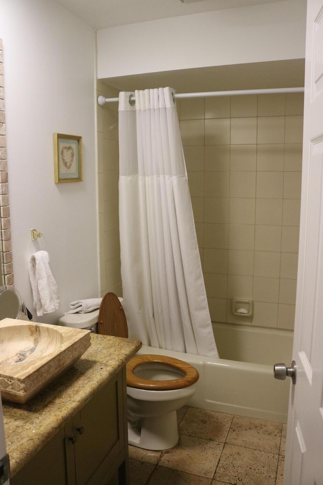 full bathroom featuring shower / bath combination with curtain, toilet, and vanity