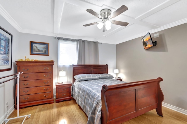 bedroom featuring baseboards, ceiling fan, ornamental molding, and light wood finished floors