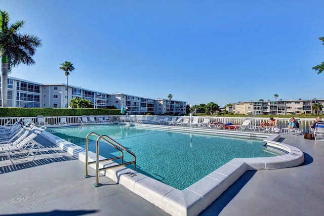 community pool featuring a patio area