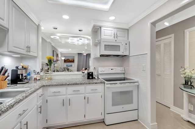 kitchen featuring white appliances, white cabinets, crown molding, and tasteful backsplash