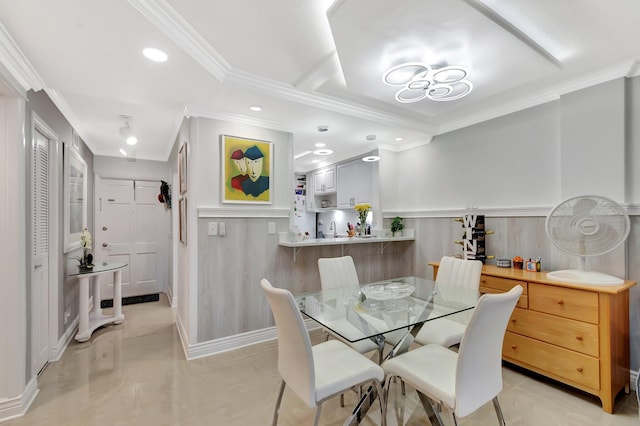 dining space featuring recessed lighting, wainscoting, and ornamental molding