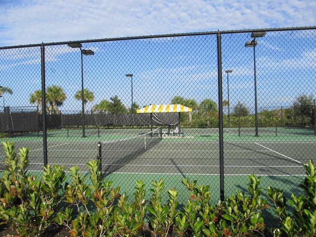view of sport court with fence