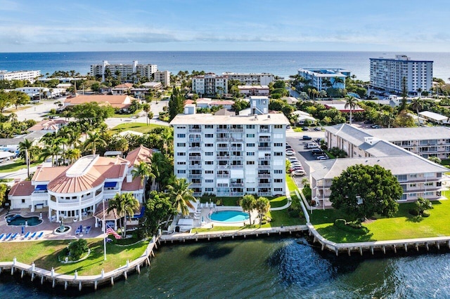 drone / aerial view featuring a view of city and a water view