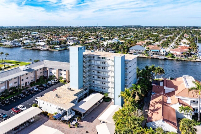 birds eye view of property featuring a water view and a residential view