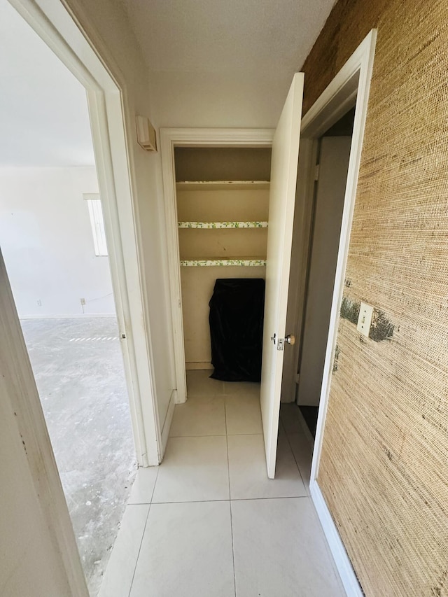 hallway featuring light tile patterned floors