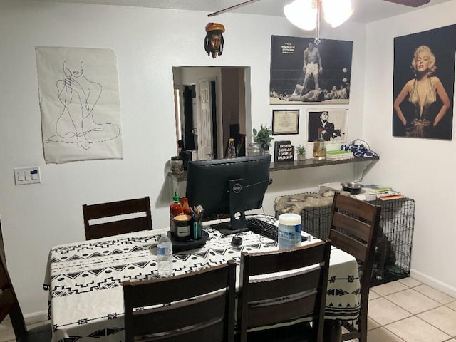 dining space featuring tile patterned floors and baseboards