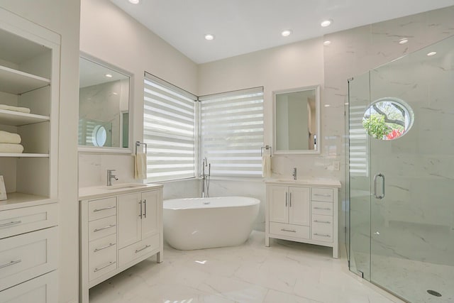 full bathroom with a sink, a marble finish shower, a soaking tub, and marble finish floor