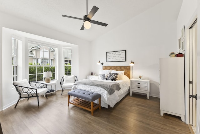 bedroom featuring high vaulted ceiling, wood finished floors, baseboards, and ceiling fan