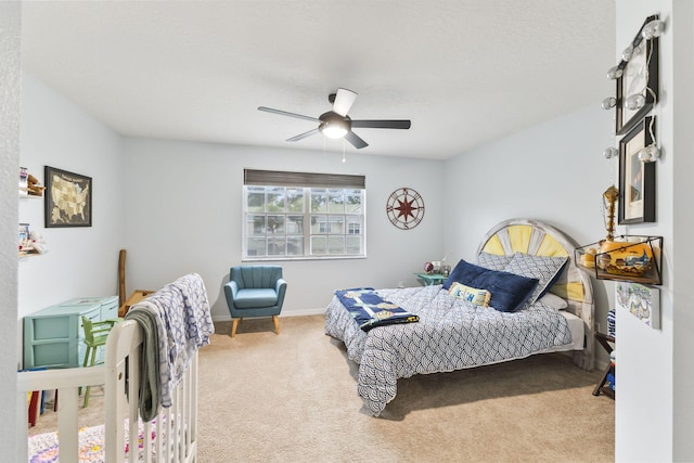 bedroom featuring baseboards, carpet, and ceiling fan