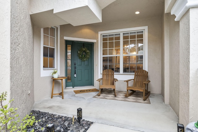 property entrance featuring stucco siding