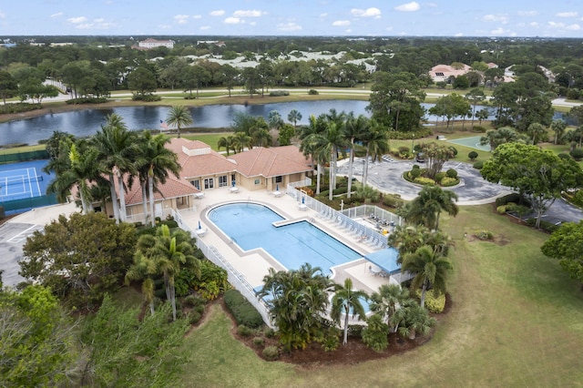 birds eye view of property with a water view