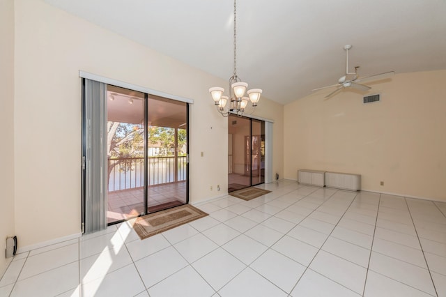 spare room featuring visible vents, a water view, lofted ceiling, ceiling fan with notable chandelier, and tile patterned floors