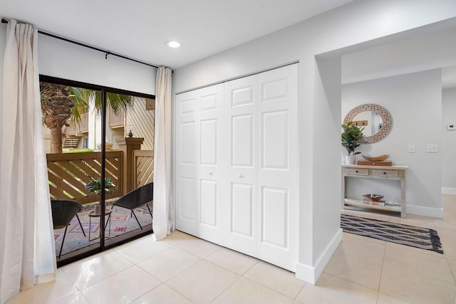 interior space featuring recessed lighting and baseboards