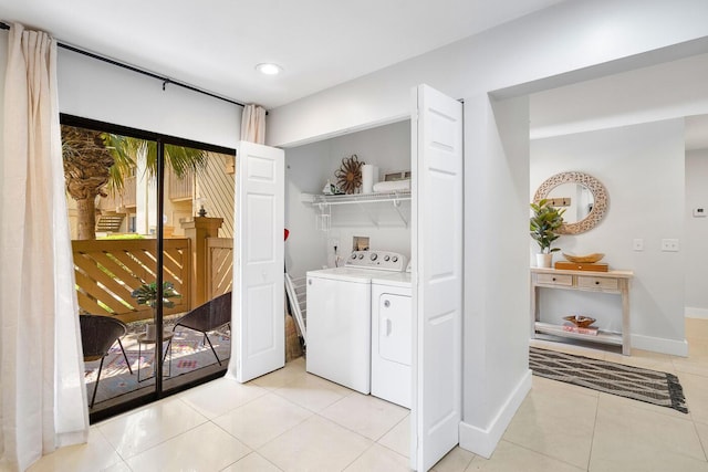 laundry area with independent washer and dryer, recessed lighting, light tile patterned floors, baseboards, and laundry area