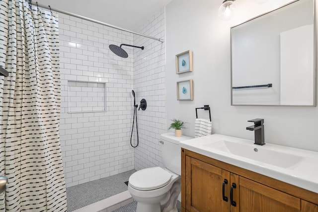 full bathroom with tiled shower, toilet, and vanity