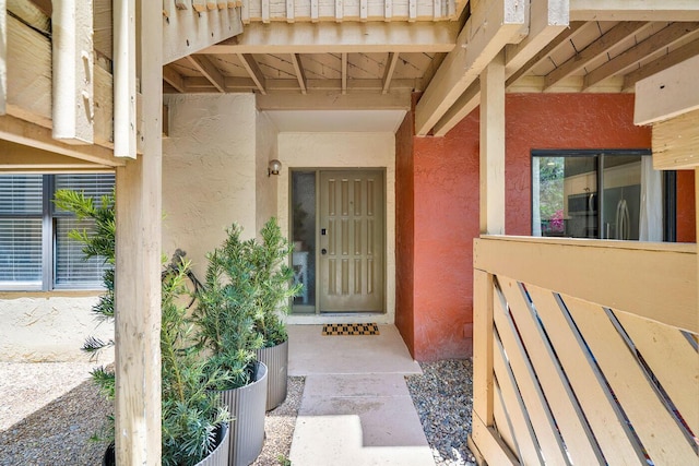 property entrance featuring stucco siding