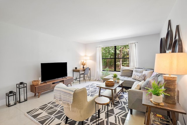 living room with light tile patterned flooring and baseboards