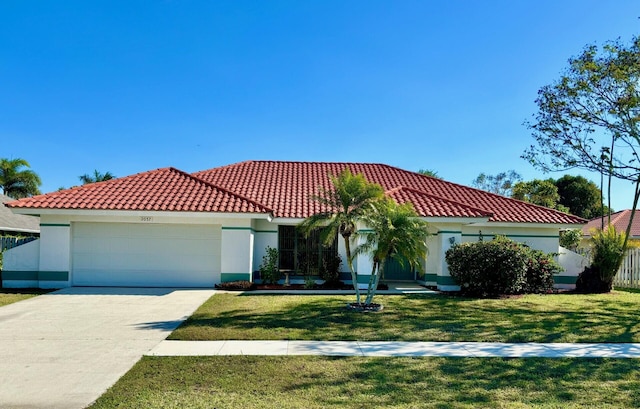 mediterranean / spanish-style house with a front lawn, an attached garage, a tile roof, and stucco siding