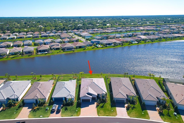 aerial view with a residential view and a water view