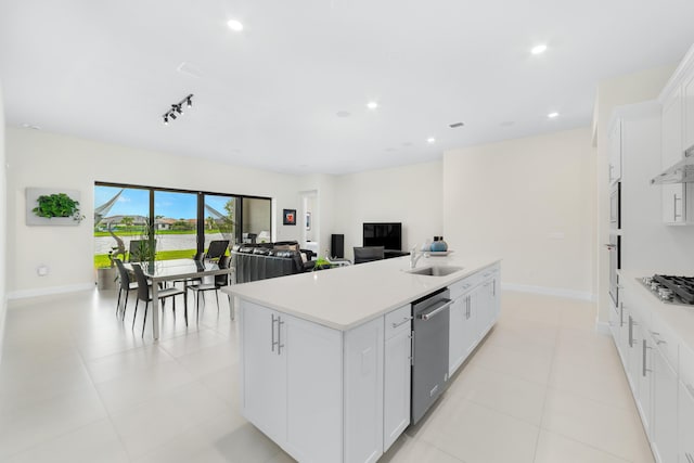 kitchen featuring an island with sink, recessed lighting, appliances with stainless steel finishes, and a sink