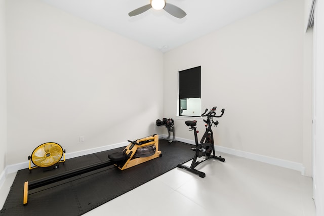 workout area with baseboards and ceiling fan