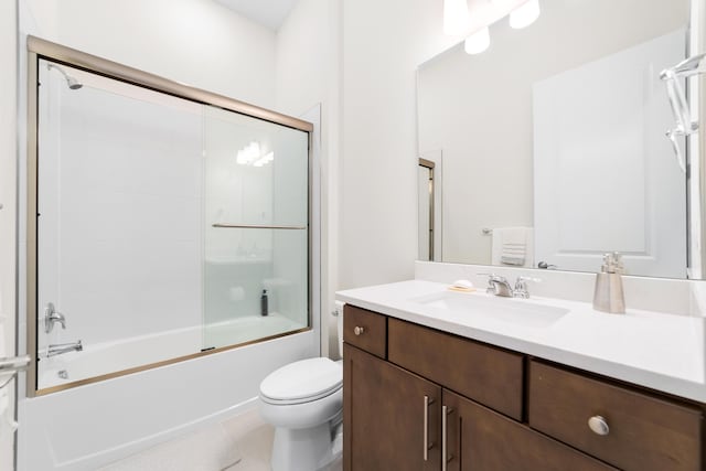 full bathroom with vanity, toilet, and combined bath / shower with glass door