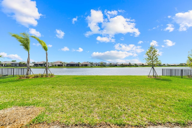 water view featuring fence and a residential view