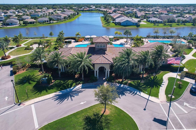 birds eye view of property featuring a residential view and a water view