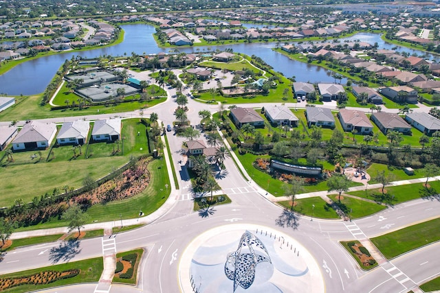 birds eye view of property with a residential view and a water view