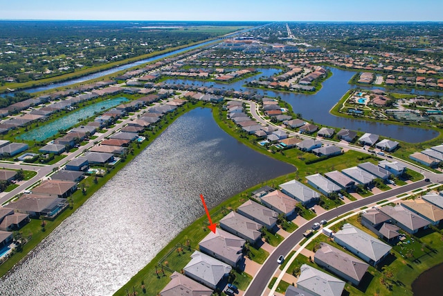 bird's eye view with a residential view and a water view