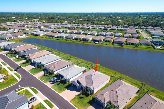 bird's eye view featuring a residential view and a water view