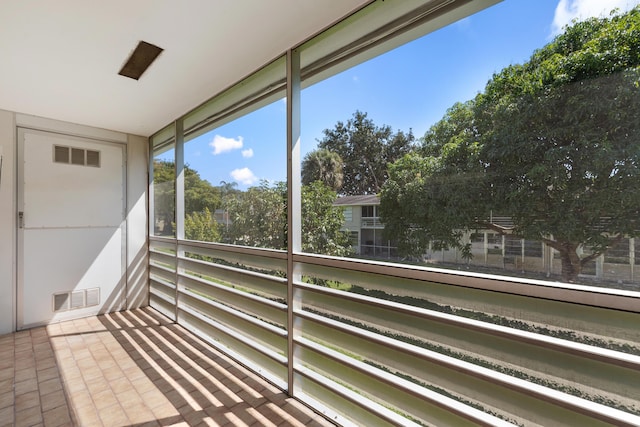 unfurnished sunroom with visible vents