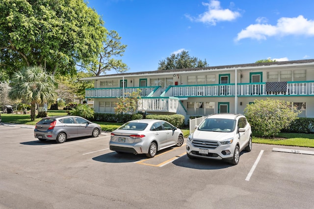 view of property with uncovered parking