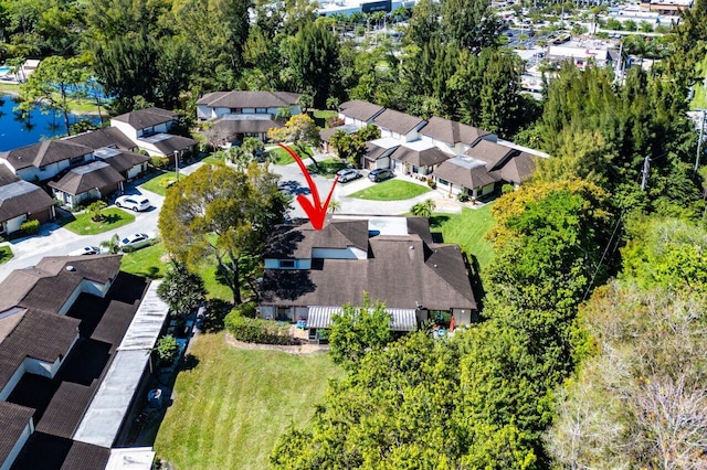 birds eye view of property with a residential view