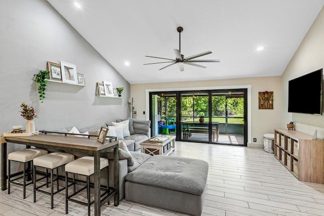 living room featuring recessed lighting, high vaulted ceiling, light wood-style floors, and a ceiling fan