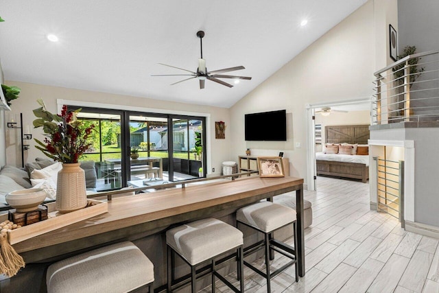 dining room with high vaulted ceiling, light wood-style floors, recessed lighting, and a ceiling fan