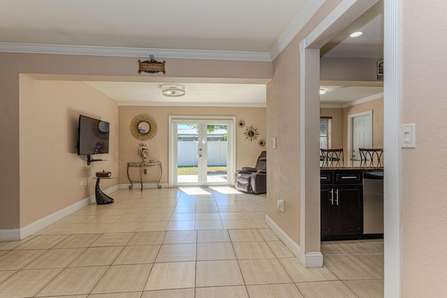 entrance foyer with crown molding, light tile patterned floors, french doors, and baseboards