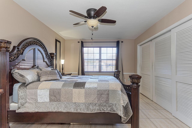 tiled bedroom featuring a closet and a ceiling fan