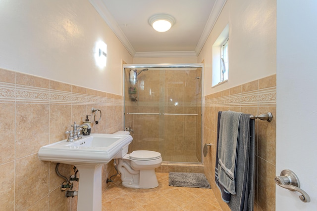 bathroom with crown molding, tile patterned floors, tile walls, and a shower stall