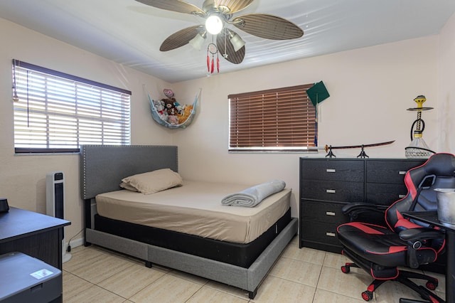 tiled bedroom with ceiling fan