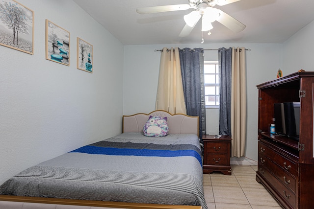 bedroom with light tile patterned floors and a ceiling fan