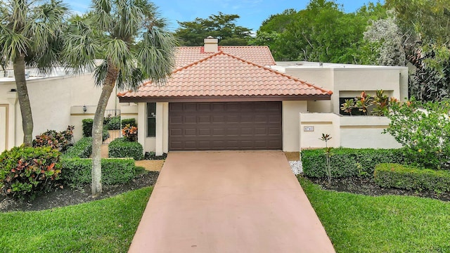 mediterranean / spanish-style house featuring a tiled roof, concrete driveway, stucco siding, a chimney, and an attached garage