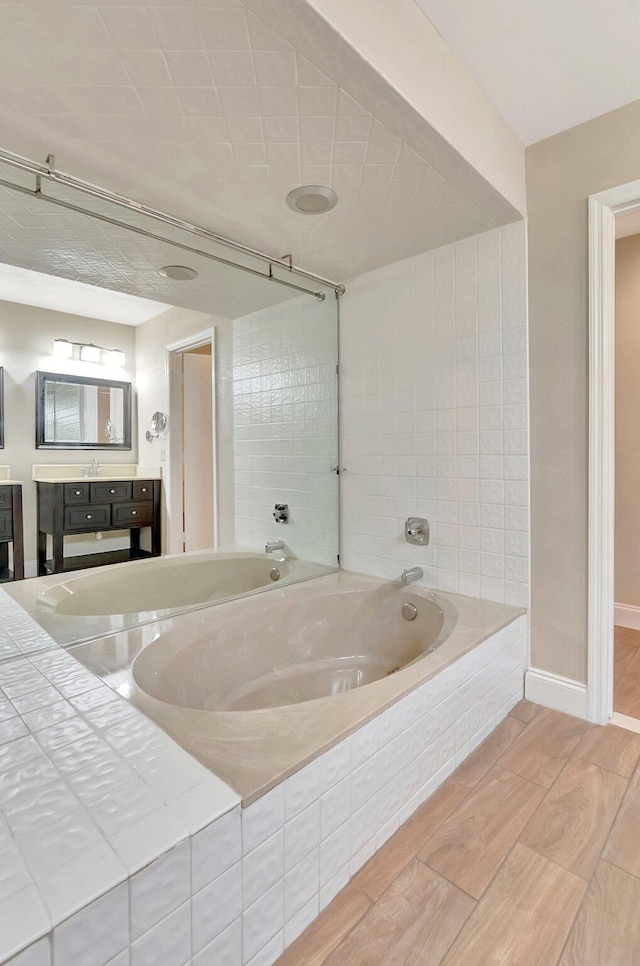 6740 Lago Vista Ter, Boca Raton, FL 33433 - full bathroom featuring baseboards, a bath, and vanity