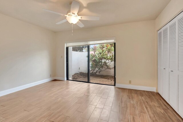 6740 Lago Vista Ter, Boca Raton, FL 33433 - unfurnished bedroom with a ceiling fan, baseboards, light wood finished floors, access to exterior, and a closet