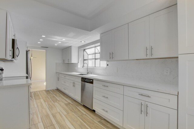 6740 Lago Vista Ter, Boca Raton, FL 33433 - kitchen featuring tasteful backsplash, appliances with stainless steel finishes, and light countertops