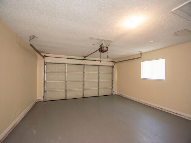 garage featuring baseboards and a garage door opener