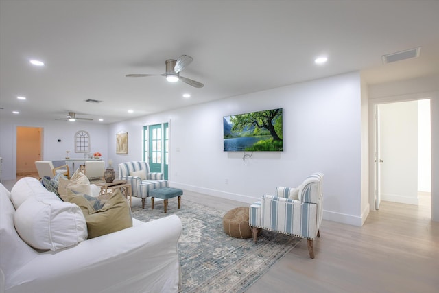 living area featuring recessed lighting, visible vents, wood finished floors, and ceiling fan