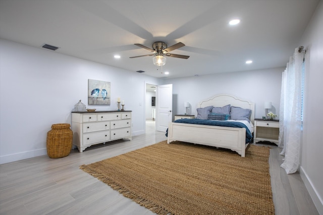 bedroom featuring visible vents, light wood-type flooring, recessed lighting, baseboards, and ceiling fan